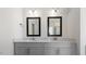Modern bathroom with double vanity, granite countertops, and framed mirrors at 552 Lemon Daisy Ln, Knightdale, NC 27545