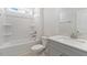 Bathroom featuring a shower-tub combination and a grey vanity with a cultured marble countertop at 552 Lemon Daisy Ln, Knightdale, NC 27545