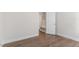 This bedroom features wood floors and a view of a closet/storage area at 552 Lemon Daisy Ln, Knightdale, NC 27545