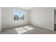 Bedroom with neutral carpet and a window offering a view of the community at 552 Lemon Daisy Ln, Knightdale, NC 27545