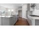 Modern kitchen with grey cabinets, stainless appliances, and center island at 552 Lemon Daisy Ln, Knightdale, NC 27545