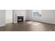 Cozy living room features a fireplace and large window at 552 Lemon Daisy Ln, Knightdale, NC 27545