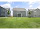 Well-maintained backyard with green grass and view of rear home elevations at 556 Lemon Daisy Ln, Knightdale, NC 27545
