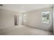 Comfortable bedroom featuring plush carpeting and abundant natural light from multiple windows at 556 Lemon Daisy Ln, Knightdale, NC 27545