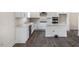 Bright kitchen featuring white cabinetry, stainless steel appliances, and a central island at 556 Lemon Daisy Ln, Knightdale, NC 27545