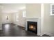 Open-concept living room with a fireplace and ample natural light, perfect for entertaining at 556 Lemon Daisy Ln, Knightdale, NC 27545