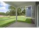 Comfortable screened-in porch overlooking landscaped backyard and a wooded view at 556 Lemon Daisy Ln, Knightdale, NC 27545