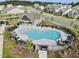 Aerial view of the neighborhood pool and community area with lounge seating at 560 Lemon Daisy Ln, Knightdale, NC 27545