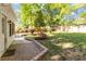 Spacious backyard featuring stone patio, privacy fence and mature trees at 5713 Old Forge Cir, Raleigh, NC 27609