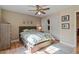 Spacious bedroom with a ceiling fan, hardwood floors, and closet space at 5713 Old Forge Cir, Raleigh, NC 27609