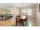 Dining area featuring a wood table and chairs, with hardwood floors and natural light at 5713 Old Forge Cir, Raleigh, NC 27609