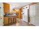 Open kitchen layout featuring an island with bar seating and an adjacent refrigerator at 5713 Old Forge Cir, Raleigh, NC 27609