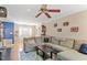 Spacious living room featuring a comfortable sectional sofa, hardwood floors, and a ceiling fan at 5713 Old Forge Cir, Raleigh, NC 27609