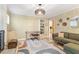 Bright sunroom with ample seating, a ceiling fan, and views of the landscaped backyard at 5713 Old Forge Cir, Raleigh, NC 27609