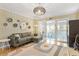 Cozy sunroom featuring comfortable seating, a ceiling fan, and plenty of natural light at 5713 Old Forge Cir, Raleigh, NC 27609