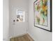 Inviting entryway featuring a stylish front door with glass, decorative mat and neutral wall art at 600 Sweet Iris Dr, Knightdale, NC 27545