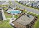 Aerial view of the community pool, clubhouse, playground, and surrounding homes in Haywood Glen at 600 Sweet Iris Dr, Knightdale, NC 27545