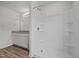 This bathroom features a shower with a built-in seat, and a double vanity with framed mirror at 6007 Austin Falls Ct, Liberty, NC 27298