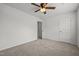 Bright bedroom featuring neutral carpet, a ceiling fan, and a doorway at 6007 Austin Falls Ct, Liberty, NC 27298