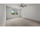 Bright bedroom featuring neutral carpet, ceiling fan, and a window with blinds at 6007 Austin Falls Ct, Liberty, NC 27298