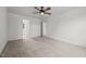 Spacious bedroom with neutral carpet, ceiling fan, and multiple doorways at 6007 Austin Falls Ct, Liberty, NC 27298