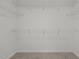 Spacious walk-in closet with wire shelving for optimal storage at 6007 Austin Falls Ct, Liberty, NC 27298