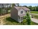 Two-story home with neutral siding, a covered front porch, and an attached two-car garage at 6007 Austin Falls Ct, Liberty, NC 27298