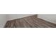 Close-up of modern, wood-look flooring providing a sleek and updated aesthetic at 6007 Austin Falls Ct, Liberty, NC 27298