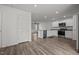 Modern kitchen featuring stainless steel appliances, granite countertops, and white cabinets at 6007 Austin Falls Ct, Liberty, NC 27298