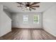 Comfortable living room featuring hardwood floors, with staircase, and natural light at 6007 Austin Falls Ct, Liberty, NC 27298