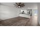 Open-concept living room featuring hardwood floors, modern ceiling fan, and an eat in kitchen at 6007 Austin Falls Ct, Liberty, NC 27298