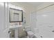 Well-lit bathroom featuring a tub-shower combo, pedestal sink, and neutral finishes, offering a clean design at 6120 Sunpointe Dr # 102, Raleigh, NC 27606