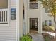 Exterior view of building entrance with unit numbers and a glimpse into the foyer area at 6120 Sunpointe Dr # 102, Raleigh, NC 27606