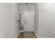 Bright foyer featuring wood floors, a white door, and a decorative wall shelf at 6120 Sunpointe Dr # 102, Raleigh, NC 27606