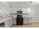 Close-up of updated kitchen showcasing countertops, cabinets, and appliances at 6120 Sunpointe Dr # 102, Raleigh, NC 27606