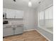 Eat-in kitchen area featuring ample natural light and updated cabinets at 6120 Sunpointe Dr # 102, Raleigh, NC 27606