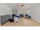 Comfortable living room with fireplace, wood floors, lots of light and a large, comfortable couch at 6120 Sunpointe Dr # 102, Raleigh, NC 27606