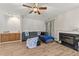 Cozy living room with fireplace, wood floors, and a ceiling fan, perfect for relaxing or entertaining at 6120 Sunpointe Dr # 102, Raleigh, NC 27606