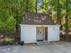 Pool house with secure fencing, featuring essential safety equipment and clear signage for responsible pool usage at 6120 Sunpointe Dr # 102, Raleigh, NC 27606