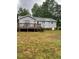 A spacious backyard features a large deck, providing ample outdoor living and entertaining space at 6216 Krandon, Raleigh, NC 27603