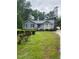 Charming single-story home features well-maintained landscaping, a quaint front porch, and a welcoming entrance at 6216 Krandon, Raleigh, NC 27603