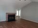 Cozy living room with brick fireplace, vaulted ceiling, and wood-look flooring at 640 Sagamore Dr, Louisburg, NC 27549