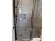 Updated shower with modern glass enclosure, custom tile work, and a decorative mosaic insert at 640 Sagamore Dr, Louisburg, NC 27549