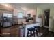 Modern kitchen featuring stainless steel appliances, white cabinets, and a breakfast bar with seating at 66 Epsom Rocky Ford Rd, Henderson, NC 27537