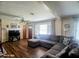 Inviting living room featuring a plush sectional sofa, hardwood floors, and a ceiling fan for added comfort at 66 Epsom Rocky Ford Rd, Henderson, NC 27537