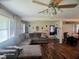 Spacious living room featuring hardwood floors, a comfortable sectional sofa, and an open layout perfect for entertaining at 66 Epsom Rocky Ford Rd, Henderson, NC 27537