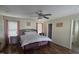 Bright main bedroom featuring a ceiling fan and hardwood floors at 66 Epsom Rocky Ford Rd, Henderson, NC 27537