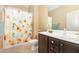 Bathroom with shower featuring decorative shower curtain and single sink vanity at 71 Potted Plant Ct, Clayton, NC 27520