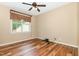 Bedroom with hardwood floors, ceiling fan, and natural light at 71 Potted Plant Ct, Clayton, NC 27520