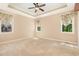 Spacious primary bedroom with plush carpet and windows at 71 Potted Plant Ct, Clayton, NC 27520